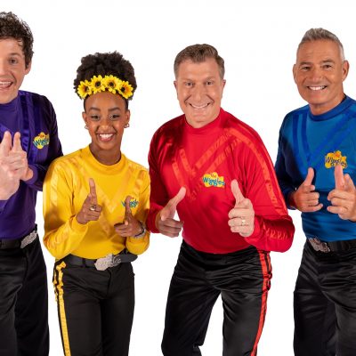 A Photo of the current 4 wiggles in trademark purple, yellow, red & blue.